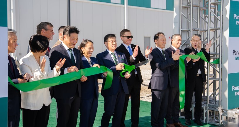 Panasonic executives at a ribbon-cutting ceremony for the grand opening of the company's new EV battery facility in De Soto, KS